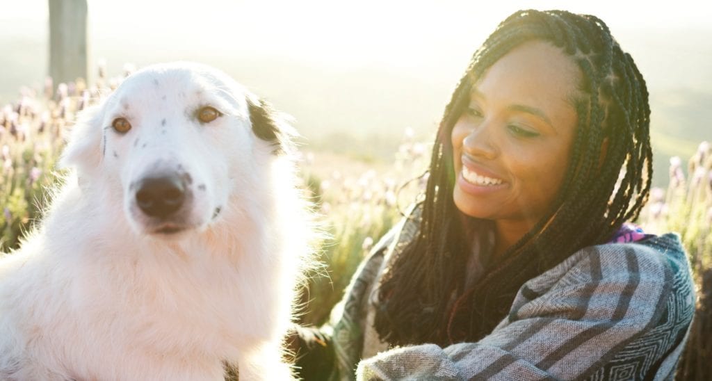 https://media-be.chewy.com/wp-content/uploads/2020/02/27122508/woman-and-a-beautiful-dog-sitting-on-the-floor-in-a-flower-field-picture-id1161599203-1024x548.jpg