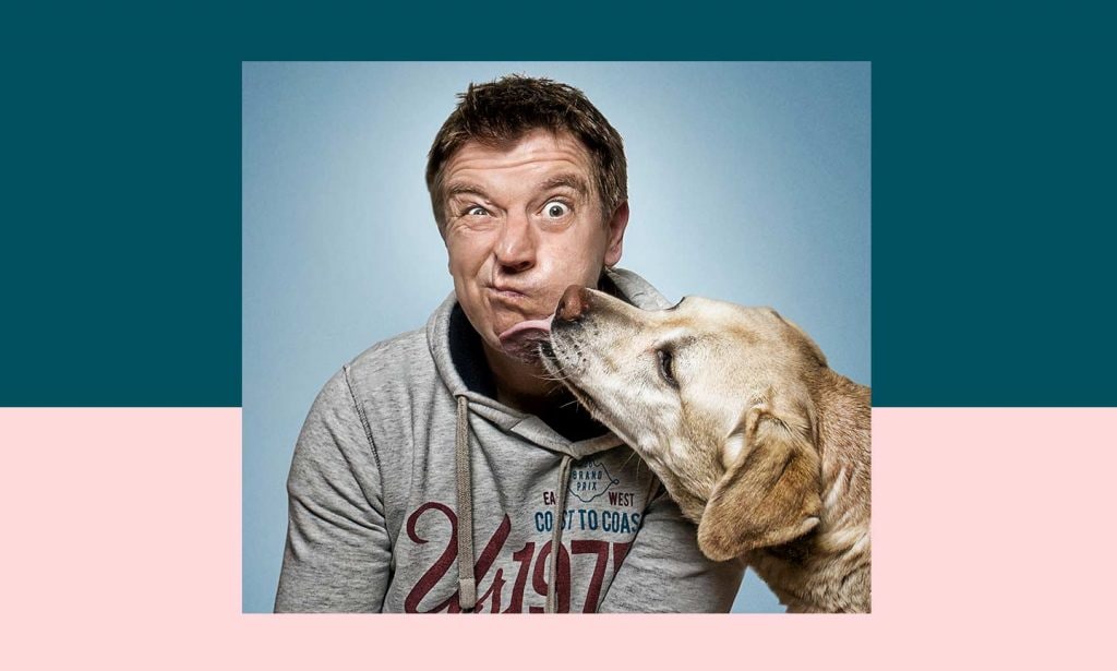 Photographer Christian Vieler getting licked by a dog