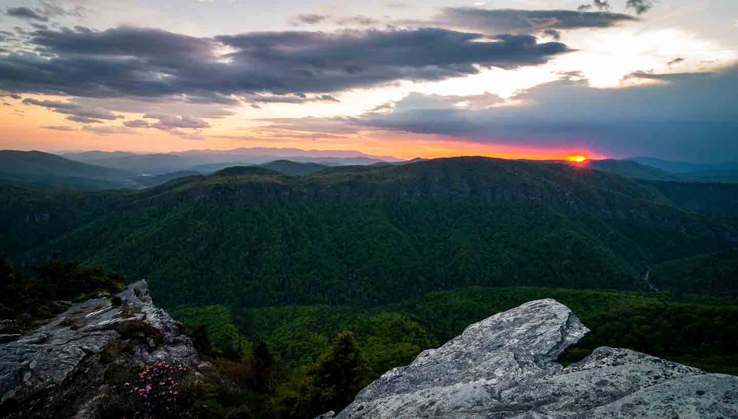 Photo of a sunset view from the top of Hawksbill Mountain