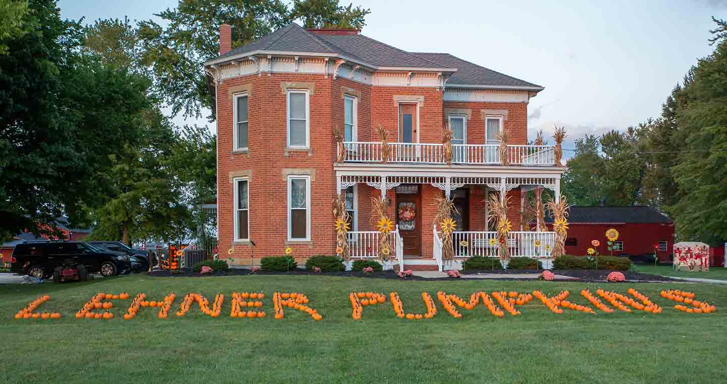 Photo of a house at Lehner’s Pumpkin Farm, with pumpkins on the laws spelling the name of the farm