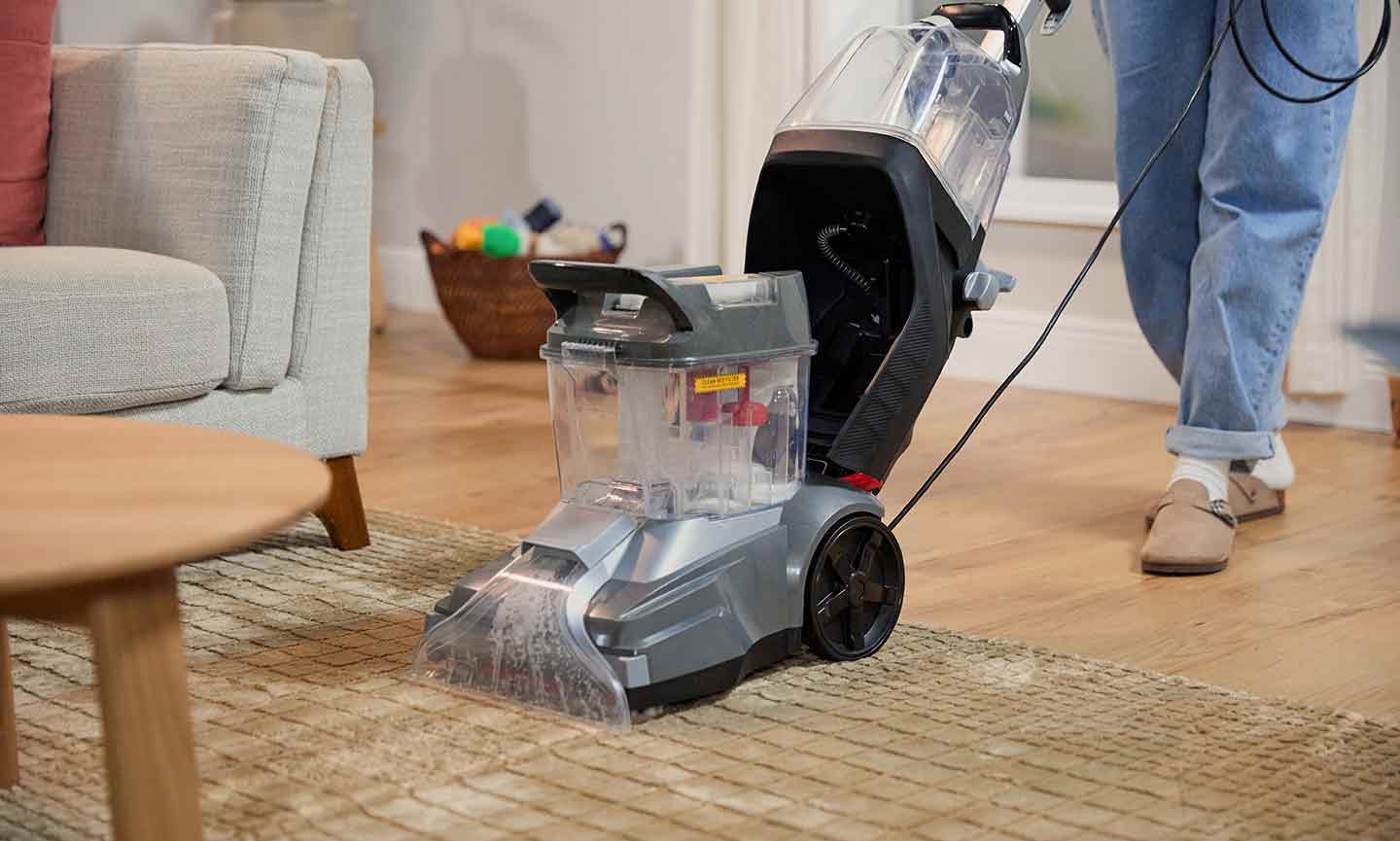 Photo of a vacuum cleaner cleaning a rug