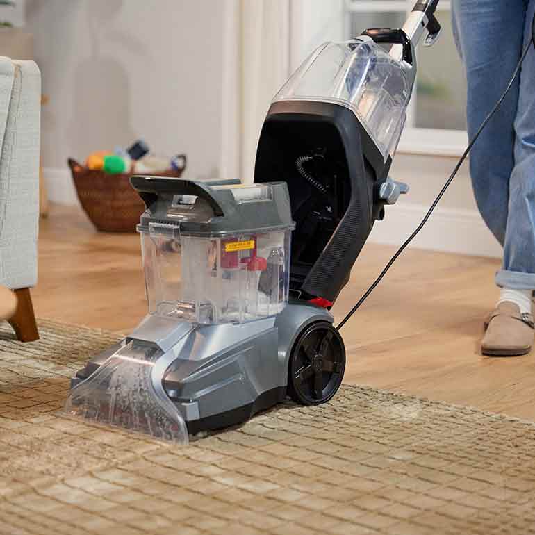 Photo of a vacuum cleaner cleaning a rug