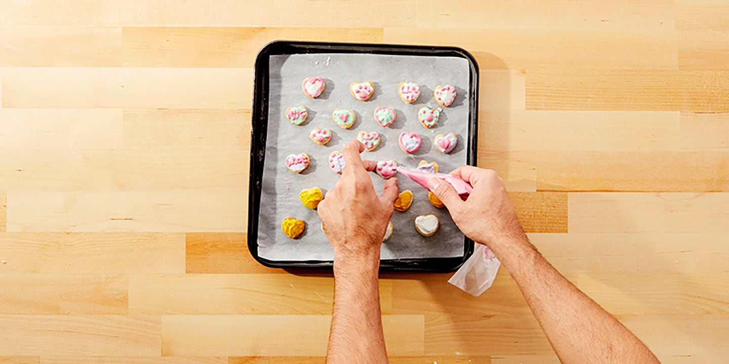 Add the color frosting you’d like to use for the decorations into your piping bag