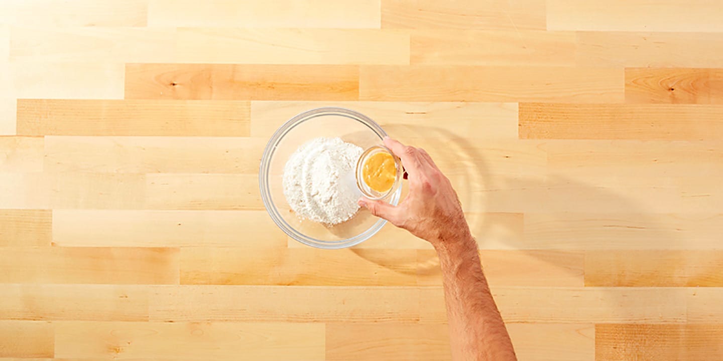 Add flour, salt, eggs and peanut butter into a large bowl and mix until smooth.