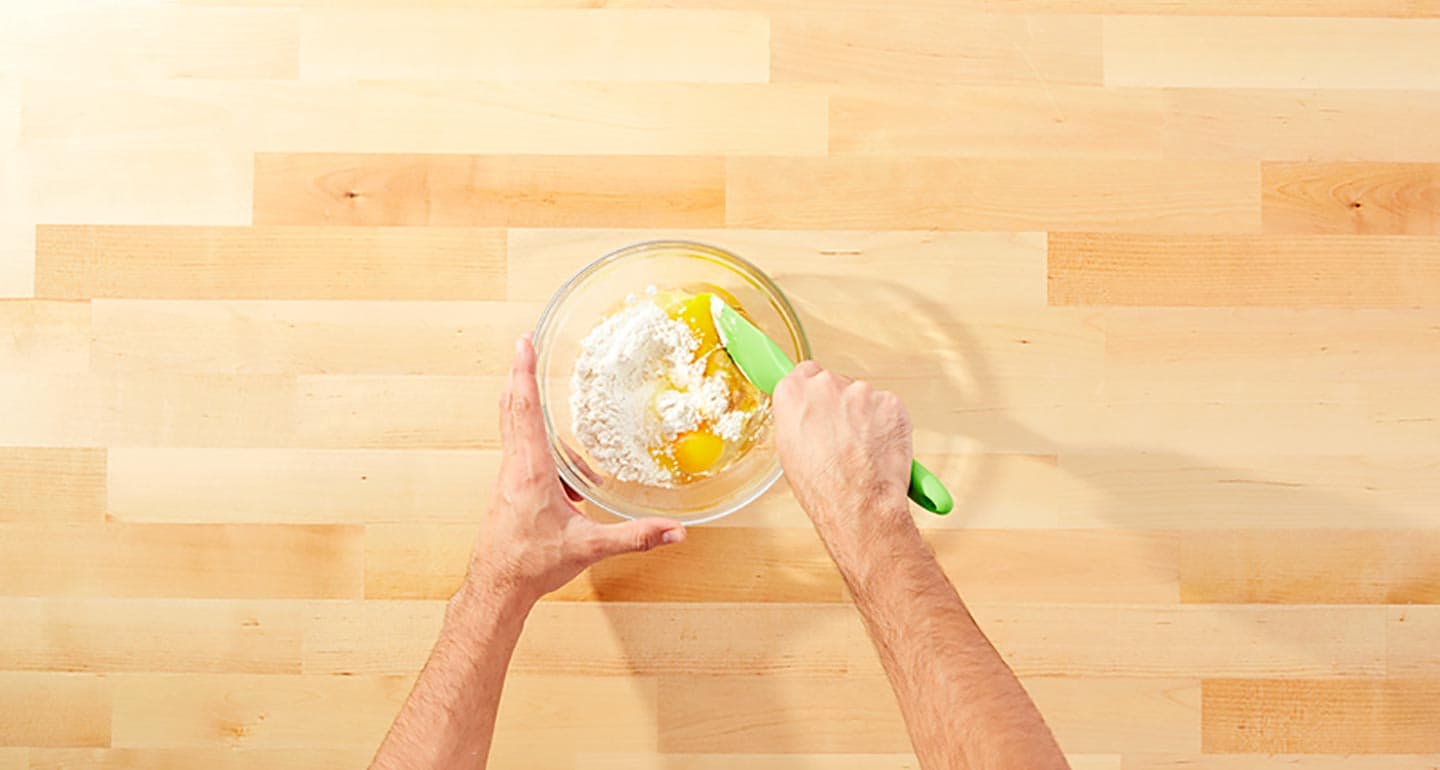 Add flour, salt, eggs and peanut butter into a large bowl and mix until smooth.
