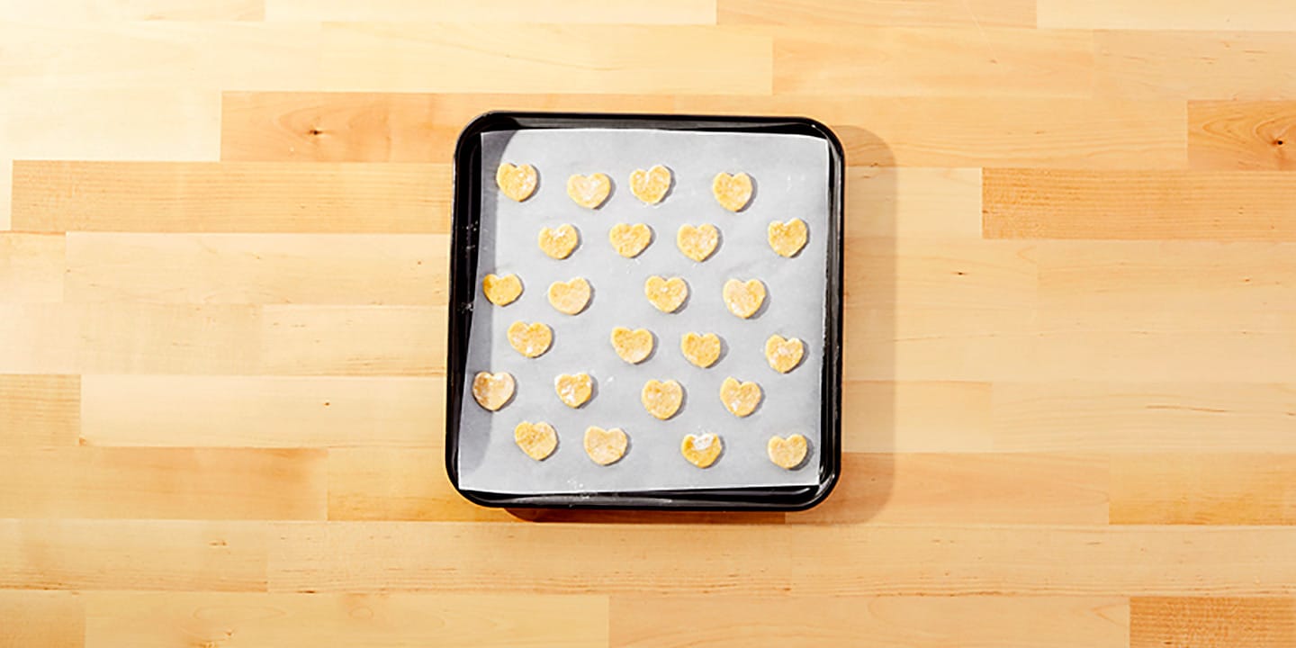 Place the hearts about 1-inch apart on the prepared baking sheet. Bake for about 8-10 minutes.